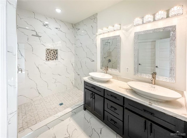 3011 E Ebano Ave, Hidalgo, TX 78557 - bathroom featuring double vanity, a marble finish shower, and marble tiled floors
