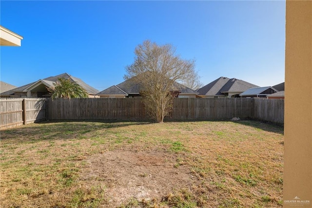 view of yard featuring a fenced backyard