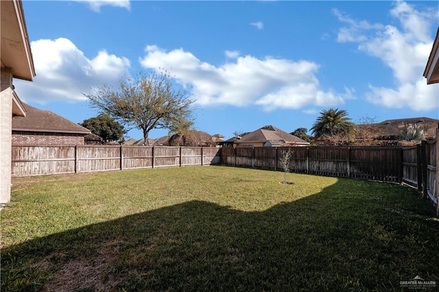 view of yard featuring a fenced backyard