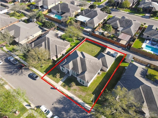 birds eye view of property with a residential view