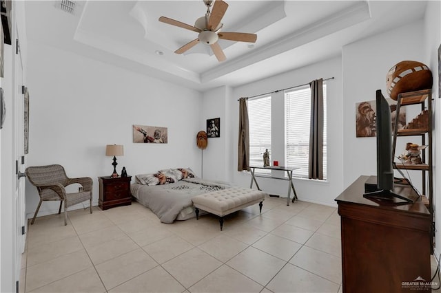 bedroom featuring light tile patterned floors, visible vents, and a raised ceiling