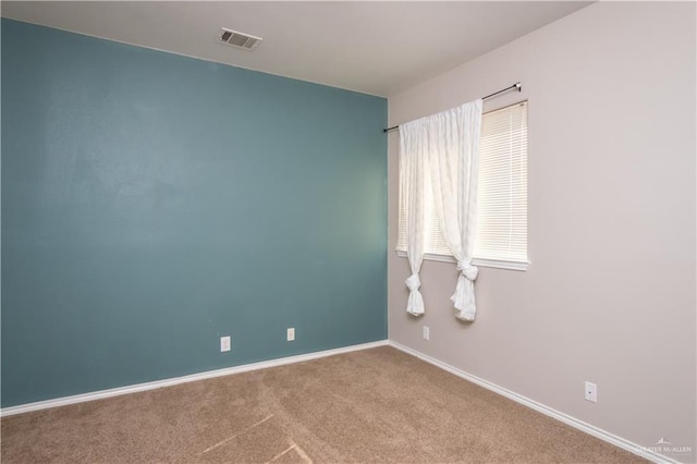 unfurnished room with carpet floors