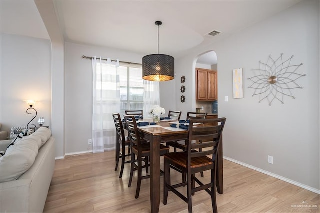 dining room with light wood-type flooring