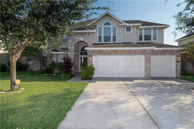 view of front of property featuring a garage and a front lawn