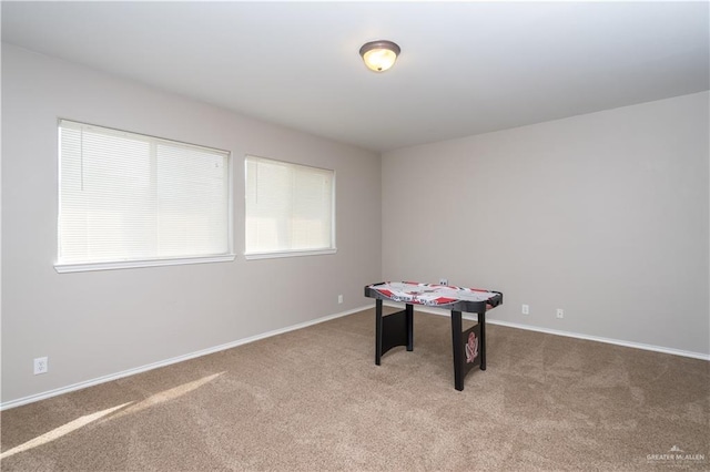 game room featuring light colored carpet