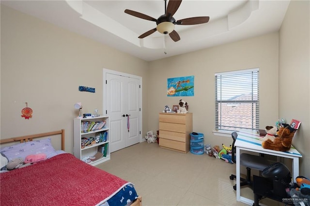2201 W Rhin Dr, Edinburg, TX 78539 - bedroom featuring a raised ceiling and ceiling fan