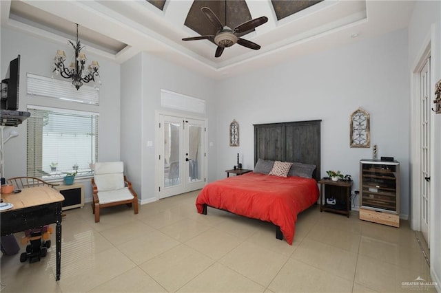 2201 W Rhin Dr, Edinburg, TX 78539 - tiled bedroom with a towering ceiling, a tray ceiling, access to outside, a chandelier, and a ceiling fan