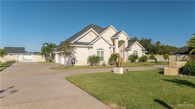 view of front of property featuring a garage and a front yard