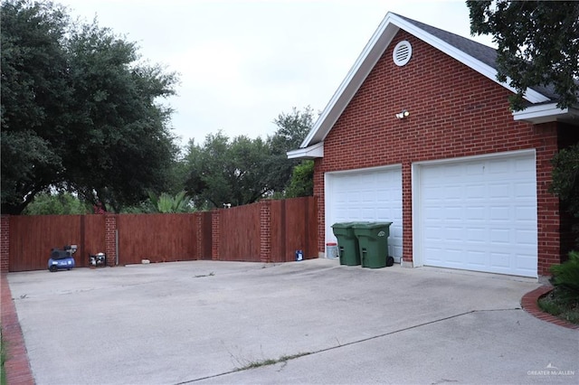 view of side of home featuring a garage