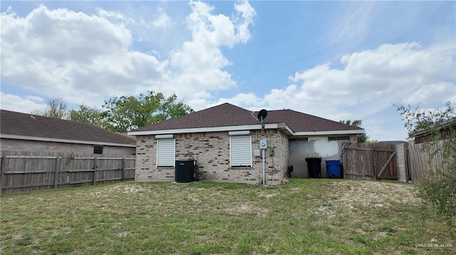 9212 N 30th St, Mcallen, TX 78504 - rear view of house featuring a fenced backyard, brick siding, central air condition unit, and a gate