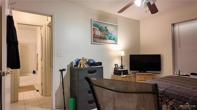 9212 N 30th St, Mcallen, TX 78504 - bedroom with ceiling fan, light tile patterned flooring, ensuite bathroom, and a textured ceiling