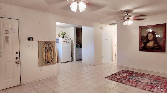 9212 N 30th St, Mcallen, TX 78504 - interior space with a ceiling fan, visible vents, light tile patterned floors, and washer / clothes dryer