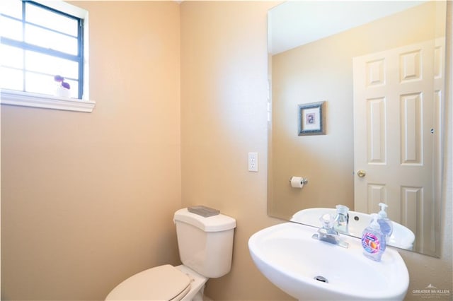 bathroom with toilet and sink