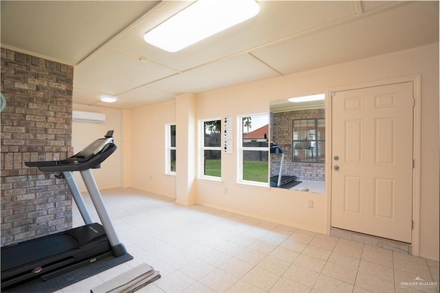 exercise area featuring a wall unit AC