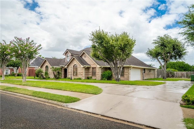 view of front facade featuring a front yard and a garage