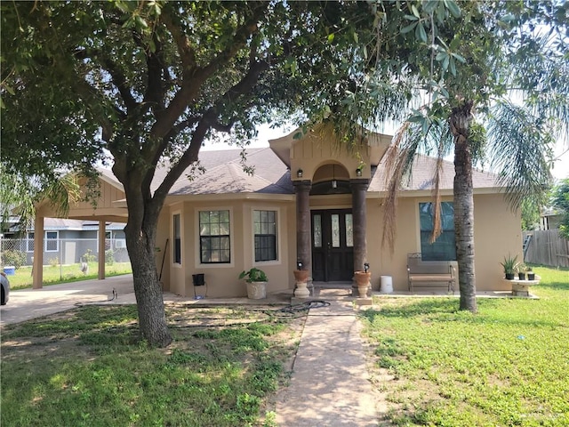 view of front of house featuring a carport and a front lawn