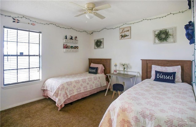 carpeted bedroom featuring ceiling fan and baseboards