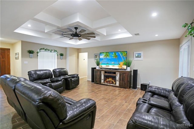 living area with wood finish floors, a lit fireplace, baseboards, and recessed lighting