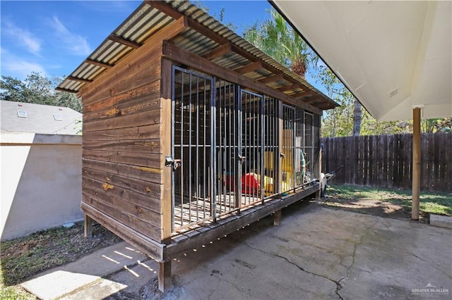 view of outdoor structure featuring an outdoor structure and fence