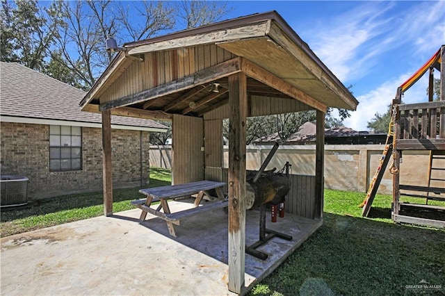 view of patio / terrace featuring fence and central air condition unit