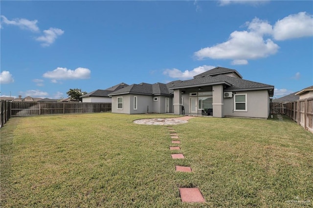 6073 Surrey Ln, Brownsville, TX 78526 - rear view of house with stucco siding and a patio