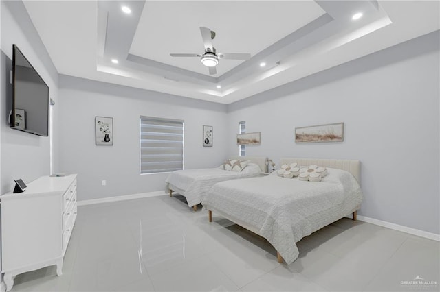 6073 Surrey Ln, Brownsville, TX 78526 - bedroom featuring a tray ceiling, recessed lighting, light tile patterned flooring, baseboards, and ceiling fan