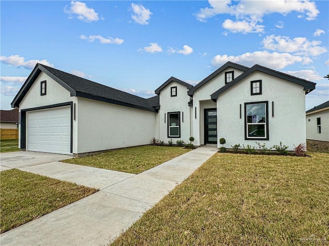 view of front facade featuring a garage and a front lawn