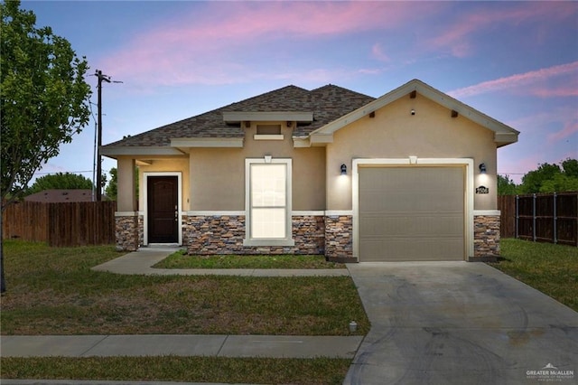 view of front facade featuring stone siding, concrete driveway, fence, a garage, and stucco siding