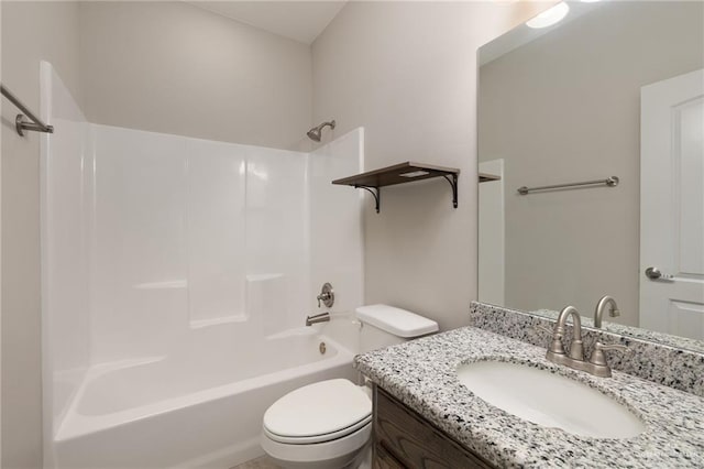 bathroom featuring toilet, vanity, and  shower combination
