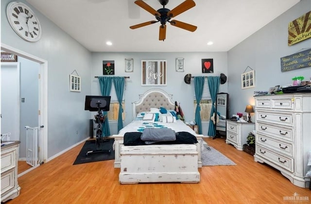 bedroom with light hardwood / wood-style floors and ceiling fan