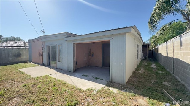 garage with fence