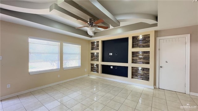 unfurnished room featuring built in features, a ceiling fan, light tile patterned flooring, beamed ceiling, and baseboards