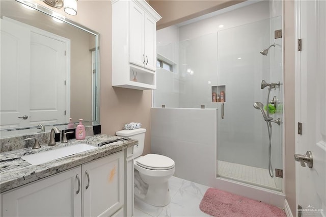 full bathroom with vanity, toilet, marble finish floor, and a stall shower