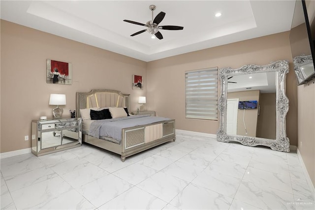 bedroom featuring baseboards, recessed lighting, ceiling fan, a raised ceiling, and marble finish floor