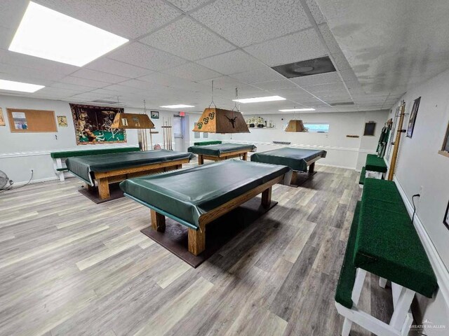 rec room featuring billiards, a drop ceiling, wood finished floors, and baseboards