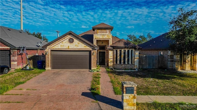 view of front of home featuring a front lawn and a garage