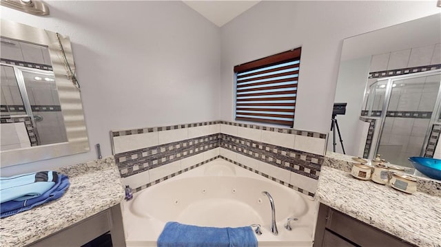 bathroom featuring vanity and separate shower and tub