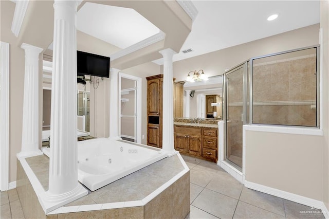 bathroom with tile patterned floors, plus walk in shower, vanity, and ornate columns