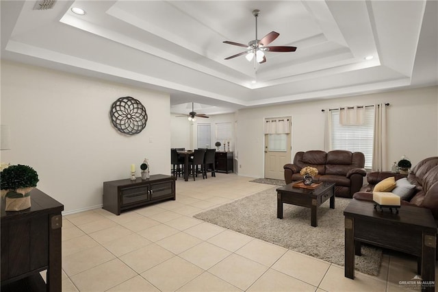 2005 Oriole Ave, Mcallen, TX 78504 - living room with a tray ceiling, ceiling fan, light tile patterned flooring, baseboards, and recessed lighting