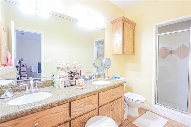 bathroom with vanity, an enclosed shower, tile patterned floors, and toilet