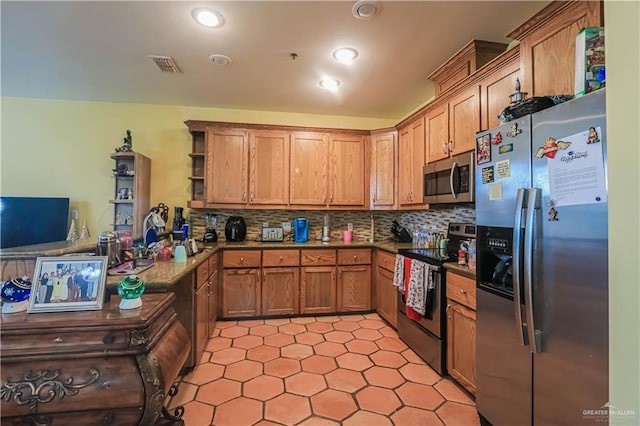 kitchen featuring stainless steel appliances and backsplash