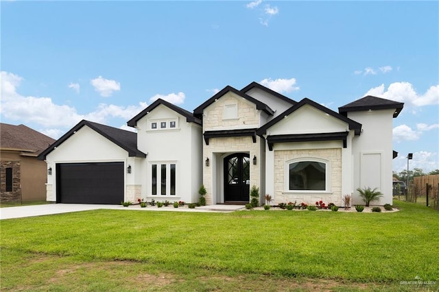 15439 E Davis Rd, Edinburg, TX 78542 - french country inspired facade with stone siding, a garage, driveway, and stucco siding
