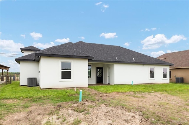 15439 E Davis Rd, Edinburg, TX 78542 - back of property with central AC, roof with shingles, and stucco siding