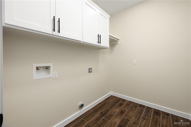 15439 E Davis Rd, Edinburg, TX 78542 - laundry area featuring cabinet space, baseboards, hookup for an electric dryer, dark wood-style flooring, and hookup for a washing machine