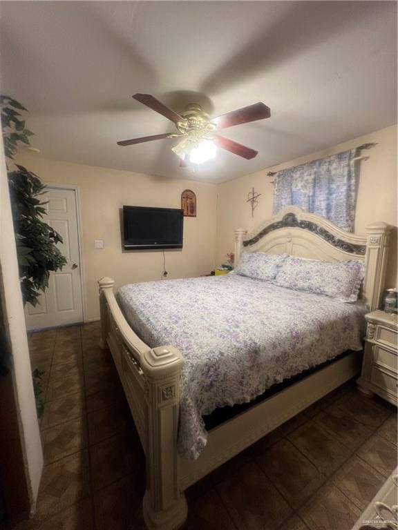 tiled bedroom with ceiling fan