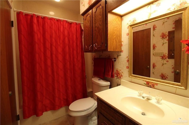 bathroom featuring tile patterned floors, a shower with curtain, vanity, and toilet