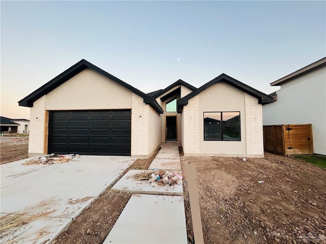 ranch-style house featuring a garage