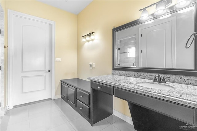 bathroom with tile patterned flooring and vanity