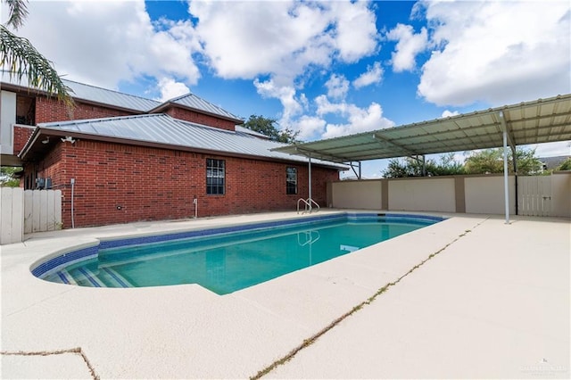 view of swimming pool with a patio