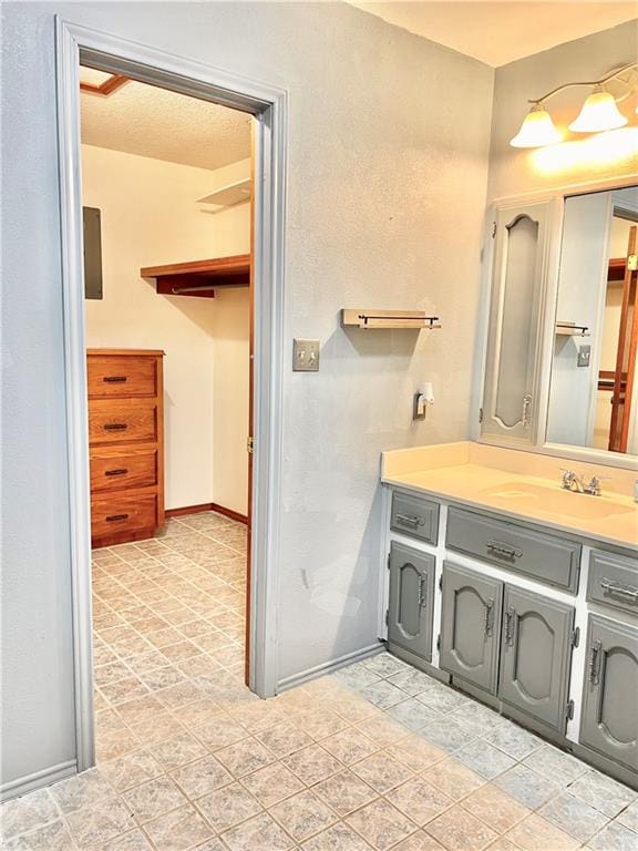 bathroom featuring vanity and a textured ceiling